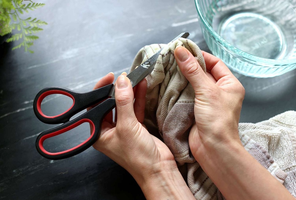 What causes sticky residue on office scissors