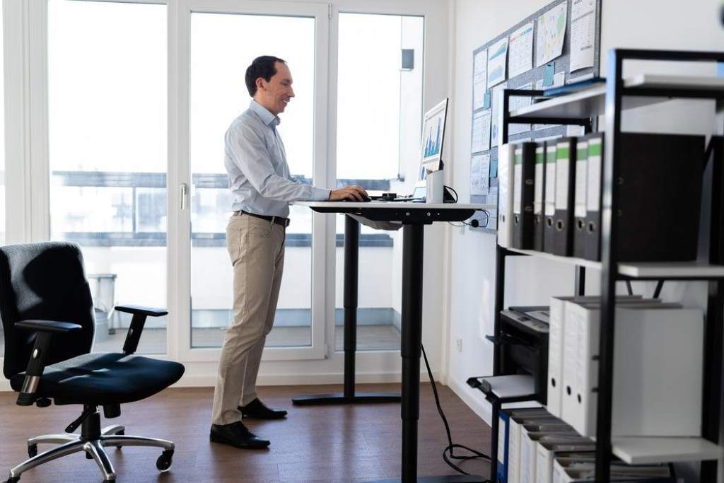 Adjustable sit stand desk in modern home office setup