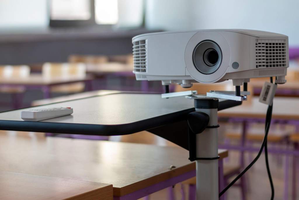 Modern video projector at business conference or lecture in office