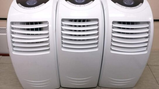 Small office with compact air conditioner providing efficient cooling
