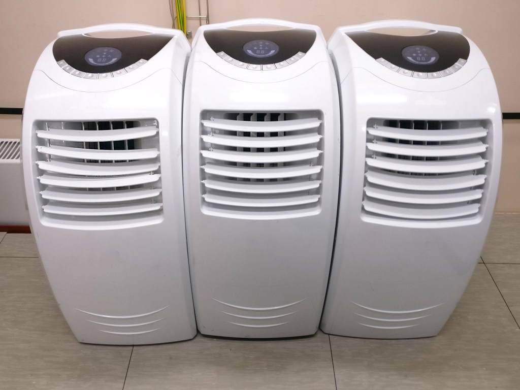 Small office with compact air conditioner providing efficient cooling