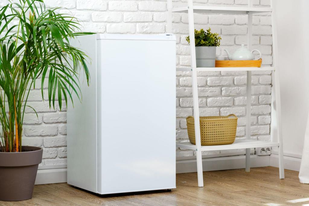 White Compact Refrigerator In A Modern Office