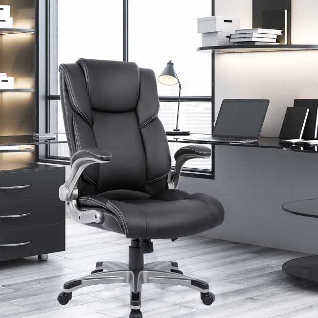 COLAMY high-back executive office chair with padded leather upholstery, inflatable lumbar support, and flip-up arms for ergonomic seating